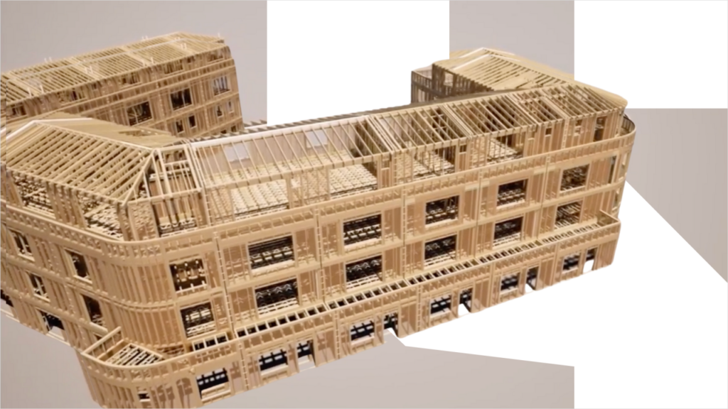 Detailed wooden architectural model showcasing sustainable timber frame design with intricate structural elements
